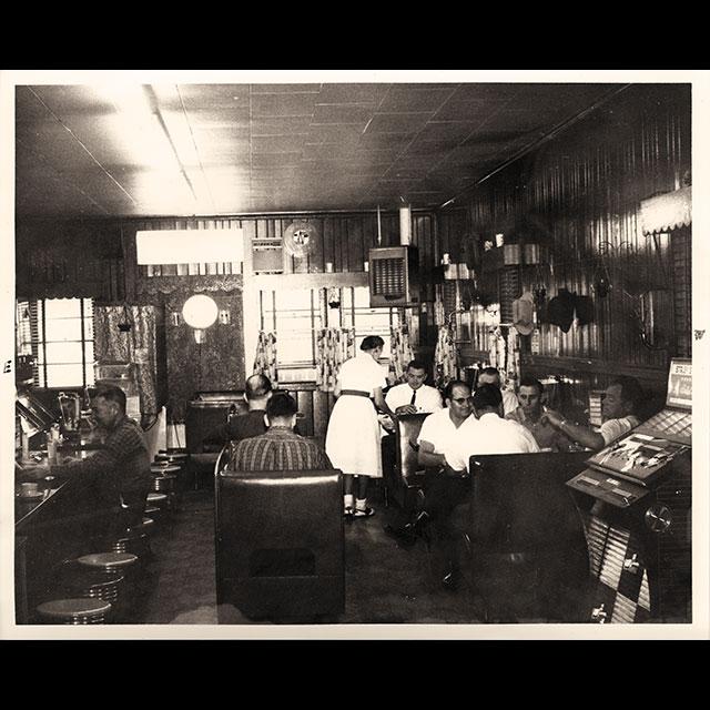 A black and white photograph of the Stanley Cafe
