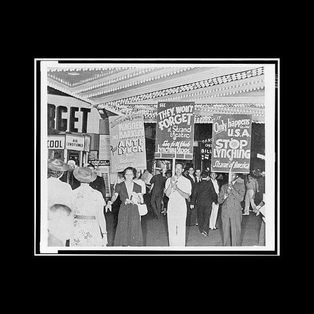 A black and white photograph of Black anti-lynching demonstrators