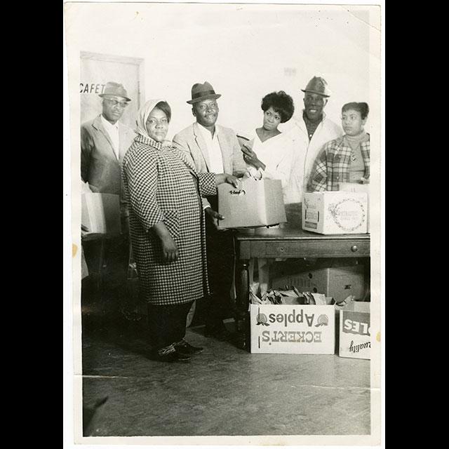 A black and white photograph of workers for the Freedom Farm Cooperative in 1969
