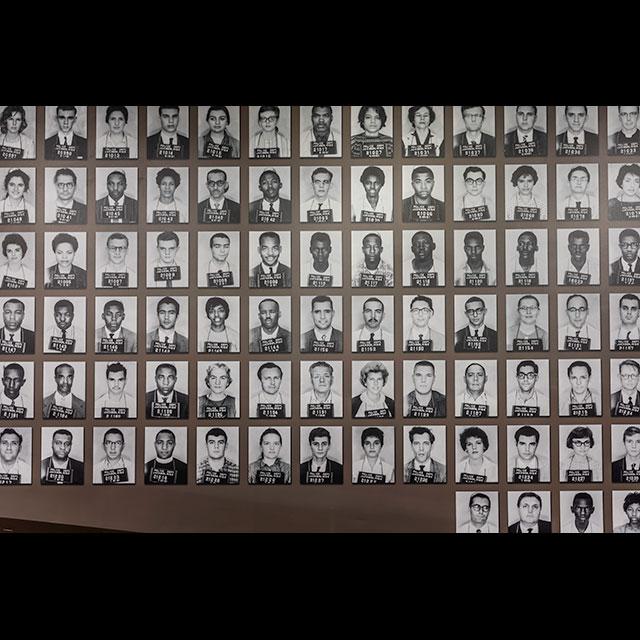 The collage of Freedom Rider mugshots on display at the Mississippi Civil Rights Museum