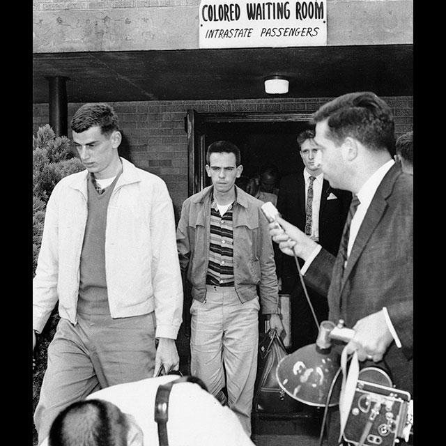 Three white volunteers leaving the Black waiting room at the Jackson bus terminal