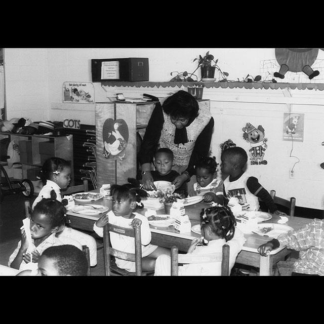 A black and white photograph of a CDGM classroom